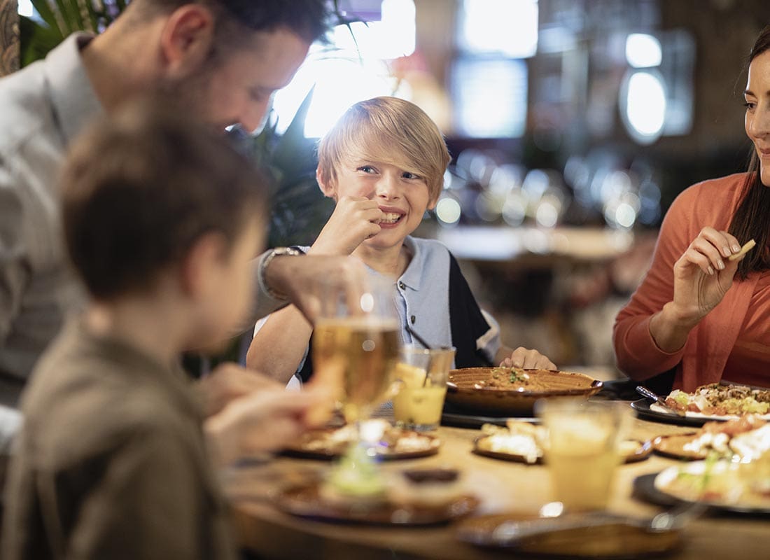 Powhatan, VA - Family Dining Together and Laughing at a Restaurant